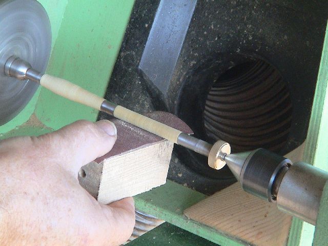 Using wood block to aid flat sanding.